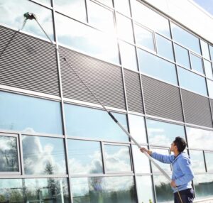 commercial cleaner cleaning windows